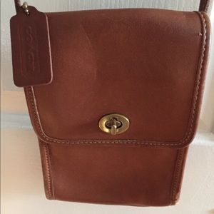 Coach classic crossbody leather turn toggle bag.